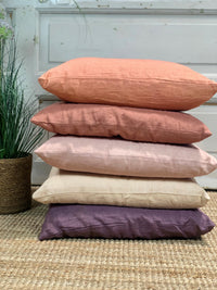 Linen pillows stacked on top of each other