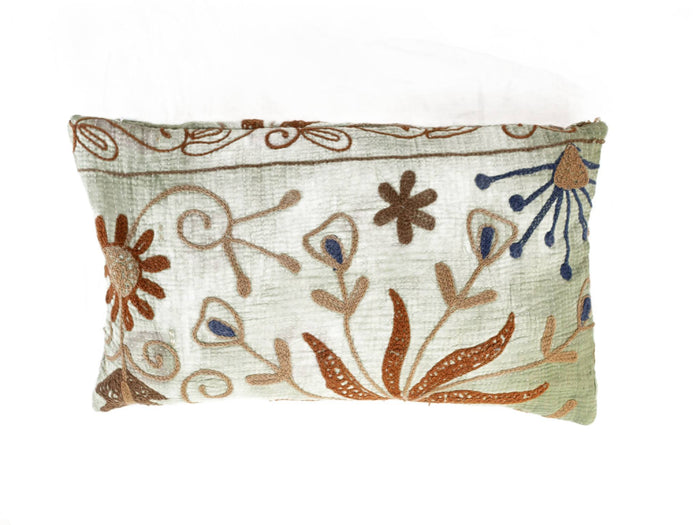 Unique suzani pillowcase 30x50 cm in white and light green with colorful embroidered patterns in rust brown and dark blue for boho ethnic sari pillow